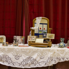 WW1 dressing table, including hand-made silk postcards and hand knitted sock.